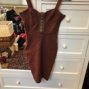Brown corset body-con dress with silver hooks.